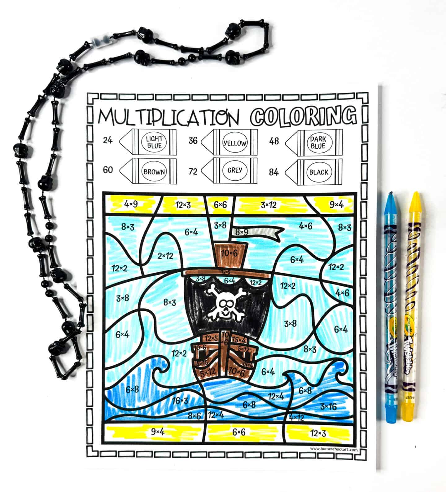 Finished pirate ship color by number worksheet where multiplication problems were used to unlock the design.