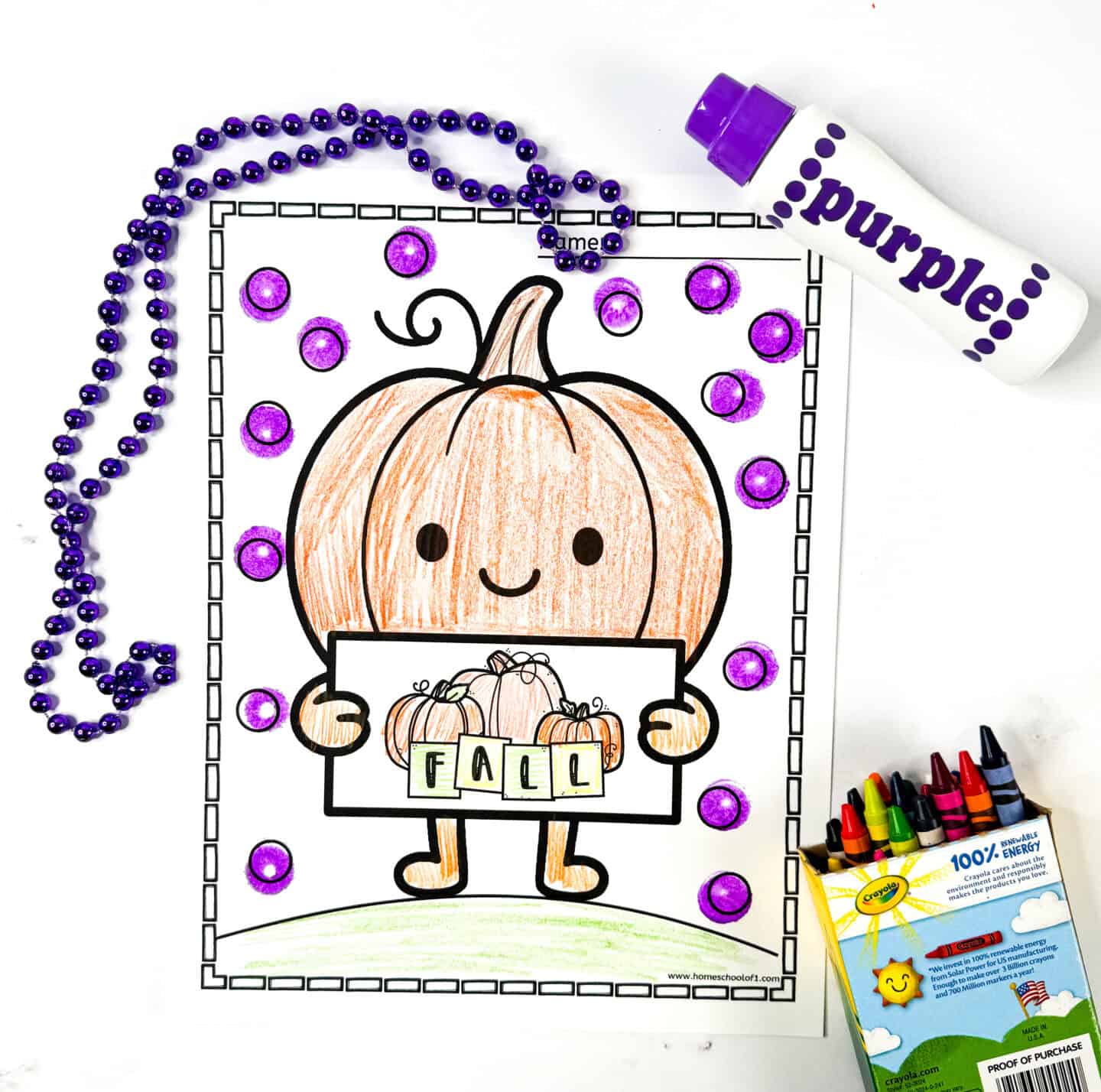 Coloring page of a smiling pumpkin holding a “FALL” sign, with a dotted background decorated using a purple dot marker.