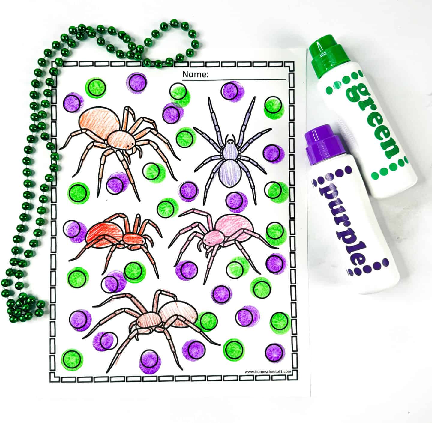 Spider dot marker coloring page featuring six spiders colored in different shades, surrounded by purple and green dots, with green beads and dot markers on the side.