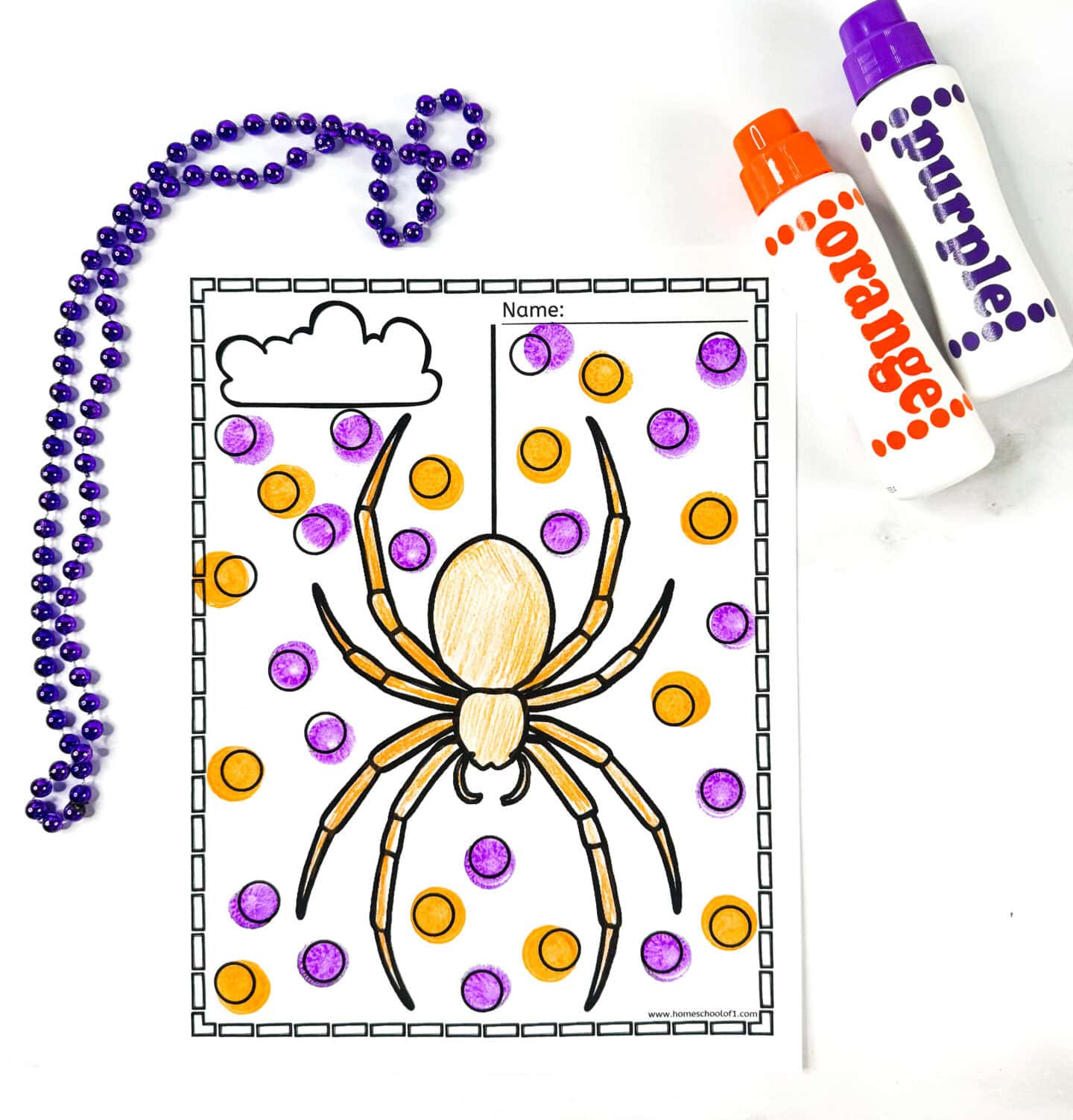 Spider dot marker coloring page with an orange and purple spider, decorated with orange and purple dots, shown with matching dot markers and a purple bead necklace.