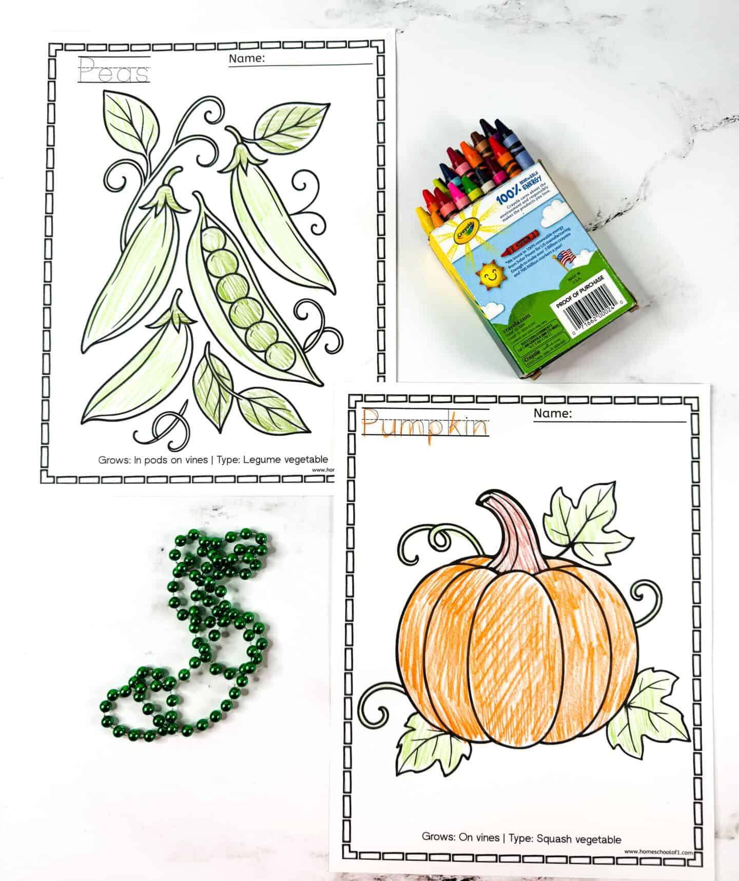 Peas and pumpkin vegetable coloring pages with green beads and a pack of crayons.