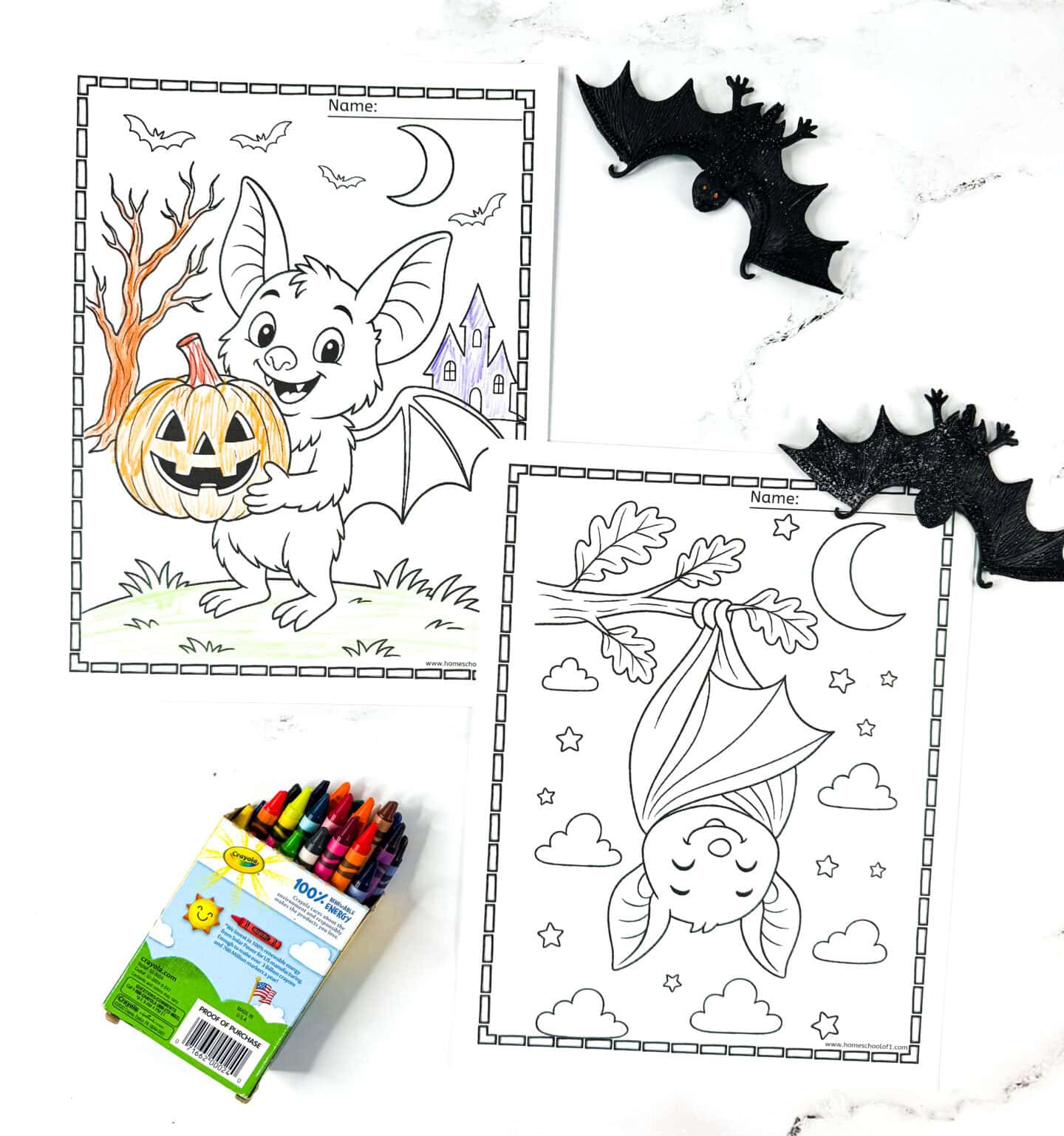 Two fall-themed bat coloring sheets—one showing a bat holding a jack-o’-lantern with a haunted house in the background, and one bat sleeping upside down on a tree branch under a starry sky.