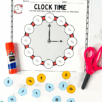 Free printable clock worksheet for kids with scissors and glue for a fun cut-and-paste time-telling activity.