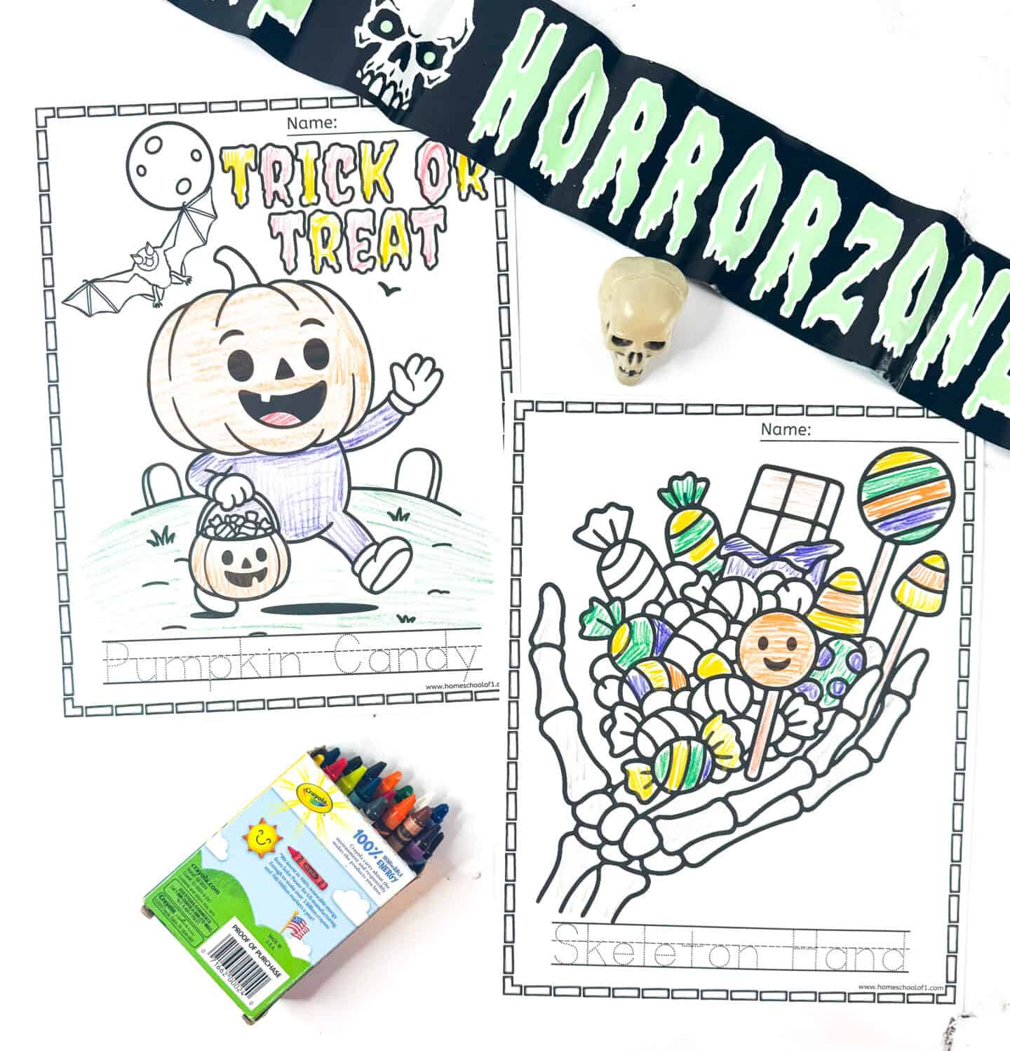 Halloween coloring pages including a pumpkin-headed trick-or-treater holding a candy bucket and a skeleton hand filled with candy.
