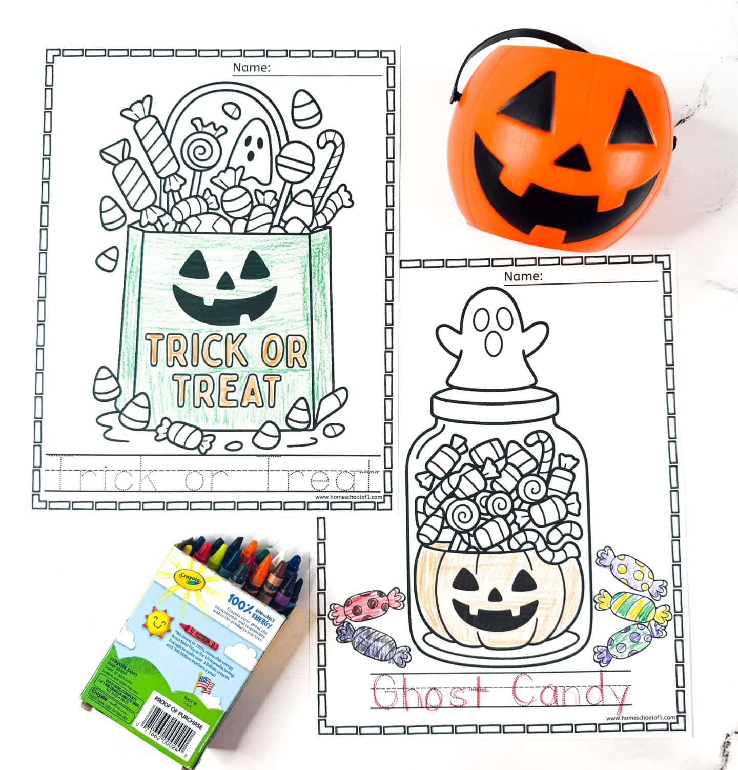 Two Halloween coloring pages showing a trick-or-treat bag filled with candy and a ghost candy jar, with crayons and a plastic pumpkin bucket.