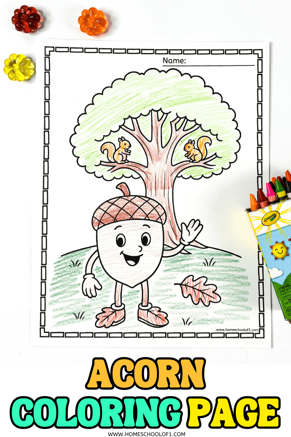 Single acorn coloring page with happy acorn character waving under a tree with squirrels, crayons beside the sheet.