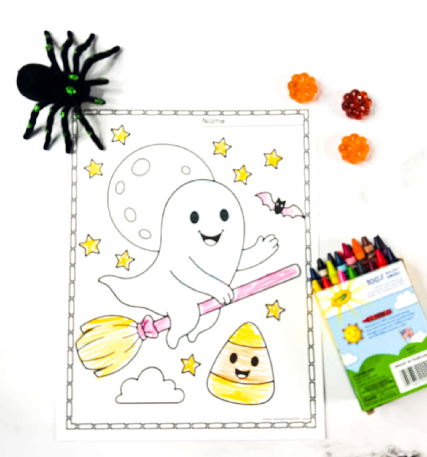 Cute ghost riding a broomstick with stars, moon, candy corn, and bat. Fun Halloween coloring page for kids.