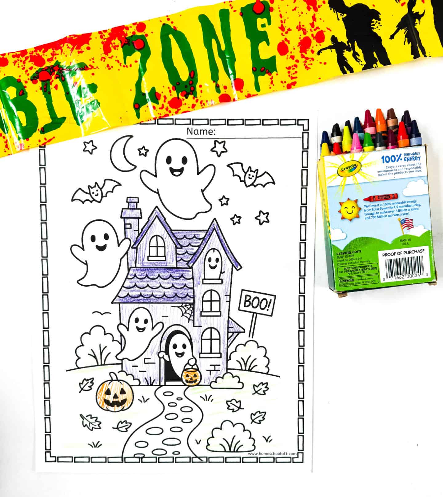 Ghosts flying around a haunted house with bats, stars, pumpkins, and a “BOO” sign.