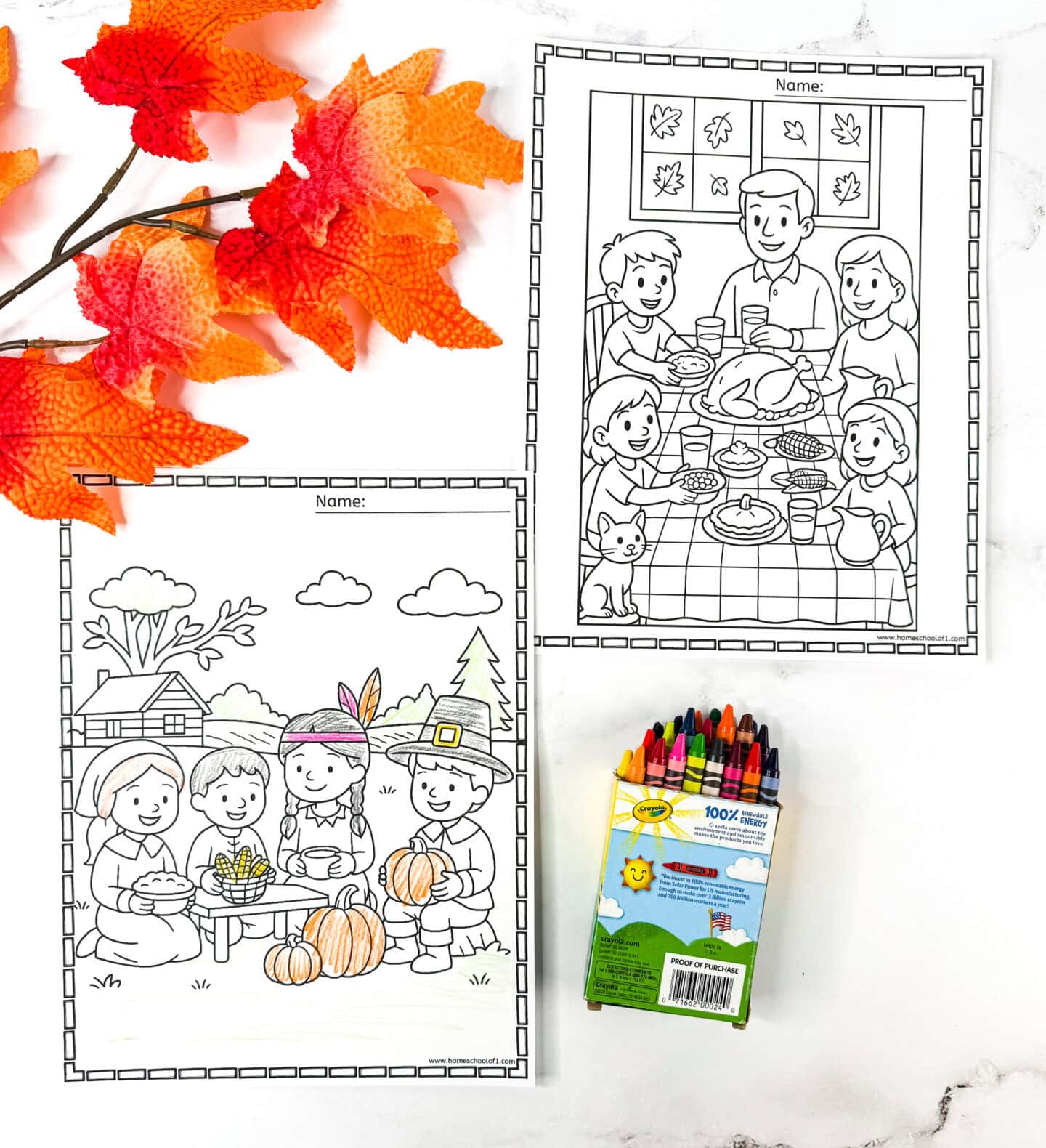 Thanksgiving coloring pages showing a family feast scene and children sharing food outdoors, with fall leaves and crayons beside them.