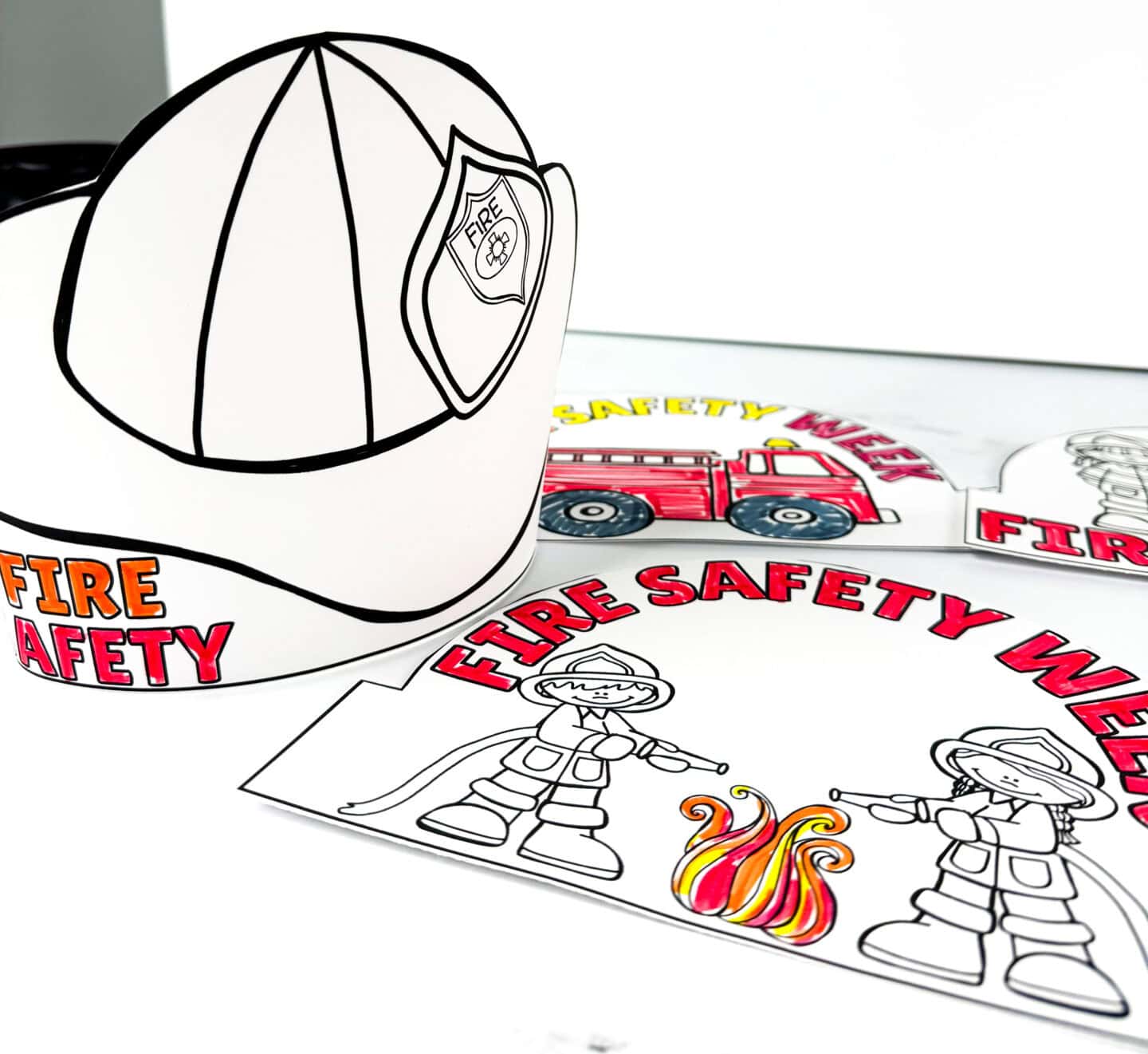 Fire safety crown printables featuring firefighter helmet, fire truck, and firefighter designs