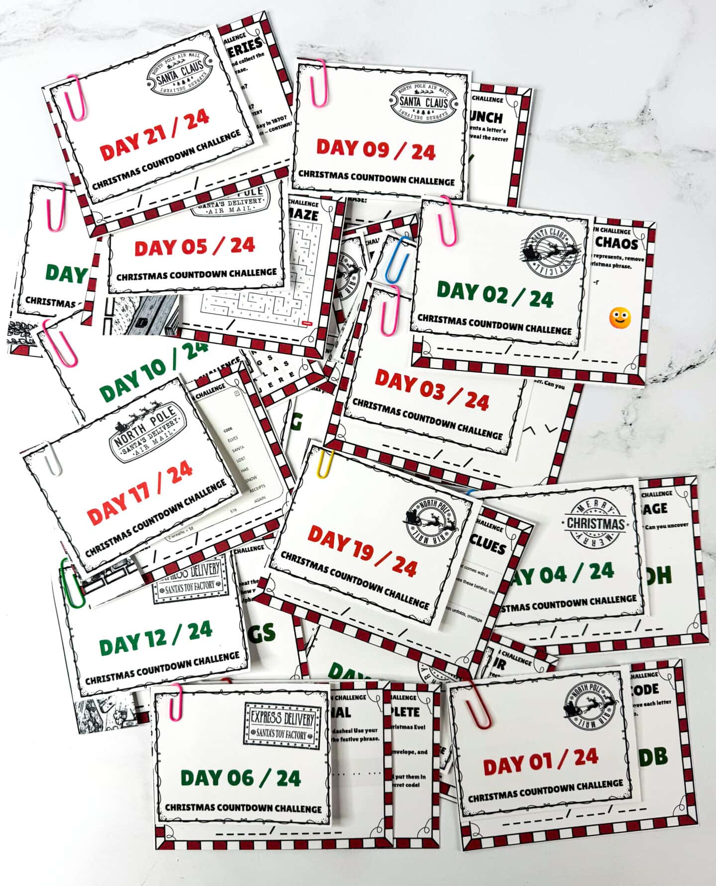 Printable Christmas puzzle cards with numbered labels attached using paper clips